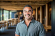 © OPPERMAN - Confident 40 year old clean shaven man posing indoors.
