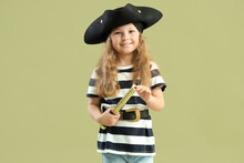 Cute Little Girl Dressed As Pirate With Spyglass On Green Background