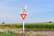An old fashioned sign warns motorists of a railroad crossing along a stretch country road in rural north central Illinois. 