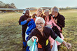 © Marko Geber - Group of senior friends taking a selfie after skydiving for the first time and completing their bucket list