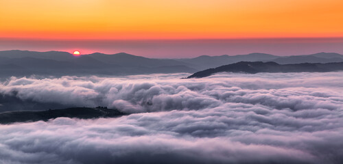 Wall Mural - Panorama with amazing sunrise. Landscape with high mountains. Morning fog and dew. Touristic resort Carpathian national park, Ukraine Europe. Natural scenery.