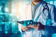 © VisualProduction - Close up of doctor holding electronic tablet and looking at health icons on it