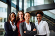 © AspctStyle - Portrait of successful group of business woman standing as a team at modern office looking at camera.