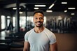 © NikoG - Smiling portrait of a happy young male african american fitness instructor in an indoor gym