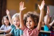 © Viewvie - Group of children raising hands in classroom at school. Education and back to school concept