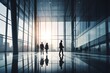© Pacharee - Business people walking in glass office building.