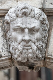 Venice, Italy - September 27, 2019: Portrait of ancient aged sculpture of old Venetian bearded man in Venice, Italy, closeup, details