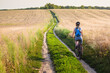 © olyphotostories - Happy Young Woman riding bicycle outside. Healthy Lifestyle