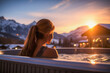 Serene winter relaxation, woman finds solace amidst snowy mountain backdrop