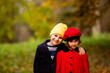 © oksix - Friends play in a beautiful autumn park together
