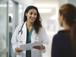 © Bela - portrait of a female doctor with a patient