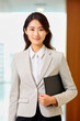 © the_lightwriter - asian businesswoman in front of bright background