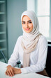 © the_lightwriter - muslim businesswoman in an office