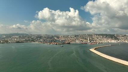 Wall Mural - Haifa commercial port dock with Container ship, stacked shipping containers and cranes