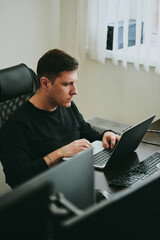 portrait professional man programmer working concentrated on computer diverse offices. modern it tec