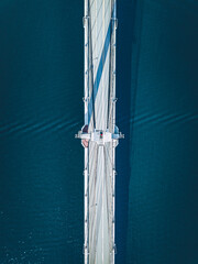 Wall Mural - Aerial view of suspension bridge road over blue lake or sea in Finland