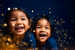 © the_lightwriter - Happy kids with golden bokeh light particles. Holiday concept.