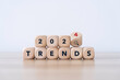 2024 forecast and trend concept. on flip wooden cube in gray background on desk. start of the new year 2024 by new trends business and fashion for plan to goals, marketing strategy concept