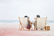 © Wesley/peopleimages.com - Relax beach, chair and back of couple love, support and communication on travel holiday, vacation or outdoor nature. Ocean sea water, sky mockup and marriage people freedom, wellness or island bond