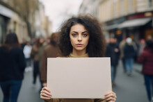 Curly Hair Woman Holding Blank Cardboard Sign In Protest Crowd On The Street