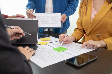 team of ui ux web designer are working together to develop mobile responsive websites with ui ux fro