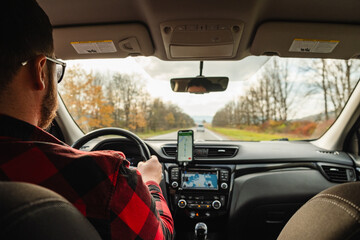 Poster - road trip concept man driving car by highway inside view