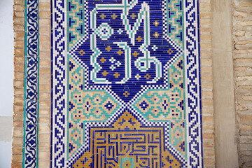  Traditional uzbek pattern on the ceramic tile on the wall of the mosque