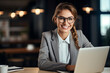 © Tetiana - Photo generative AI portrait of happy charming lady director with brown hair sitting in comfort workplace browsing media on netbook