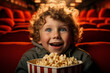 © Tetiana - Funny little child kid watching cartoon eat popcorn cinema day Generative AI