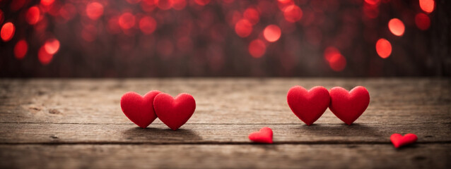 Valentines day background with red hearts on wooden background