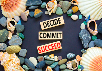 Wall Mural - Decide commit succeed symbol. Concept word Decide Commit Succeed on beautiful wooden block. Sea shell stone. Beautiful black table black background. Business decide commit succeed concept. Copy space.