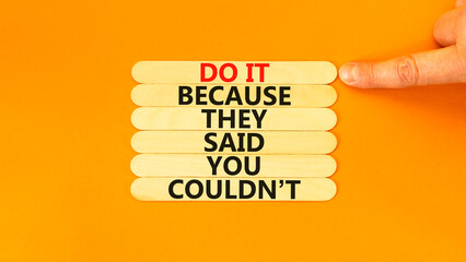 Wall Mural - You can do it symbol. Concept words Do it because they said you could not on wooden stick. Beautiful orange background. Businessman hand. Business, motivational you can do it concept. Copy space.