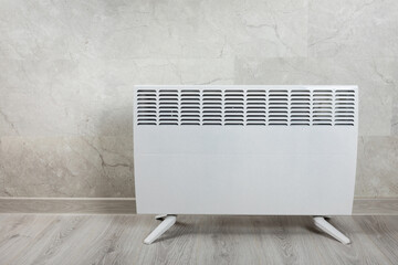 Modern radiator at home. Central heating system.Heating radiator, White radiator in the apartment. Expensive heating costs concept, close-up.Heating season. Heating.Space for text.MOCKUP 