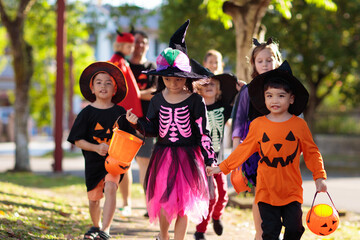 Kids trick or treat. Halloween fun for children.