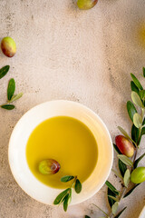 fresh green olives with leaves and olive oil