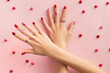 Womans hand with rinds on pink background