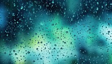Droplets Of Rain On A Window Glass On A Blurred Background.