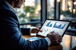 © thejokercze - Businessman using tablet analyze sales data and economic growth graph chart