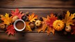 Autumn arrangement, cup of coffee on a rustic wooden table with miniature pumpkins, autumn leaves and other nature finds.