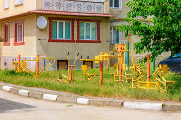 Wall Mural - Children's playground in the courtyard of an apartment building. Background with selective focus and copy space