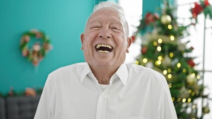 Sticker - Senior grey-haired man smiling celebrating christmas at home