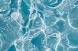 Clear water in swimming pool with ripple in clean aqua liquid. Summer wallpaper blue background and reflection of sunlight on water surface.