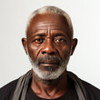 A stunning full head studio headshot of a hopeful 65-year-old African man.