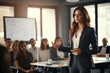 © arhendrix - A confident female executive masterfully delivers a business presentation in a boardroom, engaging her audience during an informative workshop