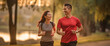 © sornthanashatr - active, caucasian, couple, man, cheerful, jogging, male, outdoors, together, woman. cheerful couple running outdoors when sunset at park or stadium. activity outdoors for healthy and heart rate.