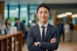 © sornthanashatr - portrait, business, businessman, office, opportunity, business person, confidence, leadership, smile, elegance. portrait image is close up businessman. him have on formal suit, behind have officer.