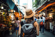 © Sasint - Young Asian traveling backpacker in Khaosan Road outdoor market in Bangkok, Thailand