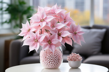 Canvas Print - Pink Christmas Star flowers. Rose poinsettia princettia bloom in vase on the table in living room background