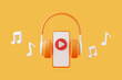 © Andrii - Cartoon headphones and melody note with play symbol flying on orange background. Concept of listening to music, radio, podcasts and books. Minimal creative concept. 3D render illustration