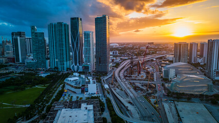 Poster - Aerial Establishing Shot of Skyscrapers and Highway in Miami City Downtown USA, American City Skyline